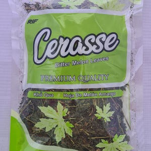 May include: A clear plastic bag of dried Cerasse, also known as Bitter Melon Leaves. The bag has a green and white label with the text "Cerasse" and "Premium Quality". The net weight is 0.75 oz (21 grms).