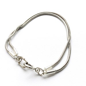 Double Stacked Stainless Steel Snake Chain Bracelet. This piece will arrive with a gift box and ribbon, ready for gift giving. image 1