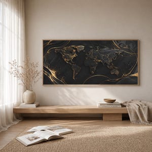 May include: A large, rectangular wall art piece featuring a world map design. The map is rendered in black with gold accents and a wooden frame. The artwork hangs above a wooden bench with books and a decorative bowl.