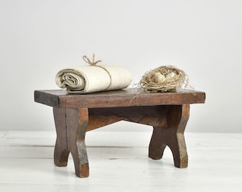Small wooden bench handcrafted from reclaimed farm wood for your rustic French Country Decor
