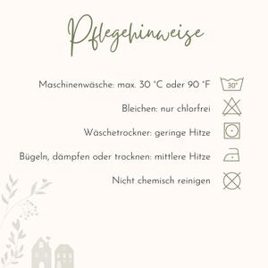 Puede incluir: Una tarjeta color crema con el texto "Pflegehinweise" en escritura cursiva. La tarjeta proporciona instrucciones de cuidado de la ropa, incluyendo lavado a m&aacute;quina a 30&deg;C o 90&deg;F, no usar lej&iacute;a con cloro, secar en secadora a baja temperatura, planchar a temperatura media y no limpiar en seco.