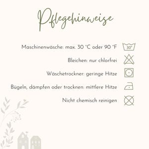 May include: A care instruction card with the heading Pflegehinweise, featuring icons for machine wash at 30 degrees Celsius or 90 degrees Fahrenheit, non-chlorine bleach, low heat tumble dry, medium heat ironing, and no dry cleaning.