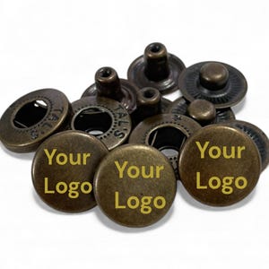 May include: A set of three ceramic mugs with a speckled, matte finish. Each mug features a different color: light blue, cream, and gray. The mugs have a simple, modern design and a comfortable handle.