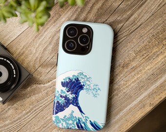 May include: A blue and white phone case with a graphic of a large wave. The case is designed for an iPhone.