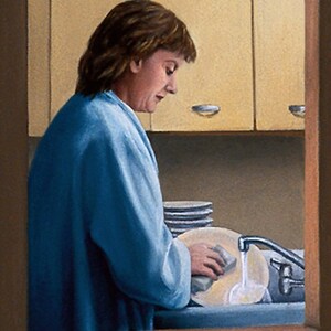 May include: A woman in a blue robe washes dishes in a kitchen sink. She is using a sponge to wash a plate. There are other plates stacked on the counter behind her.