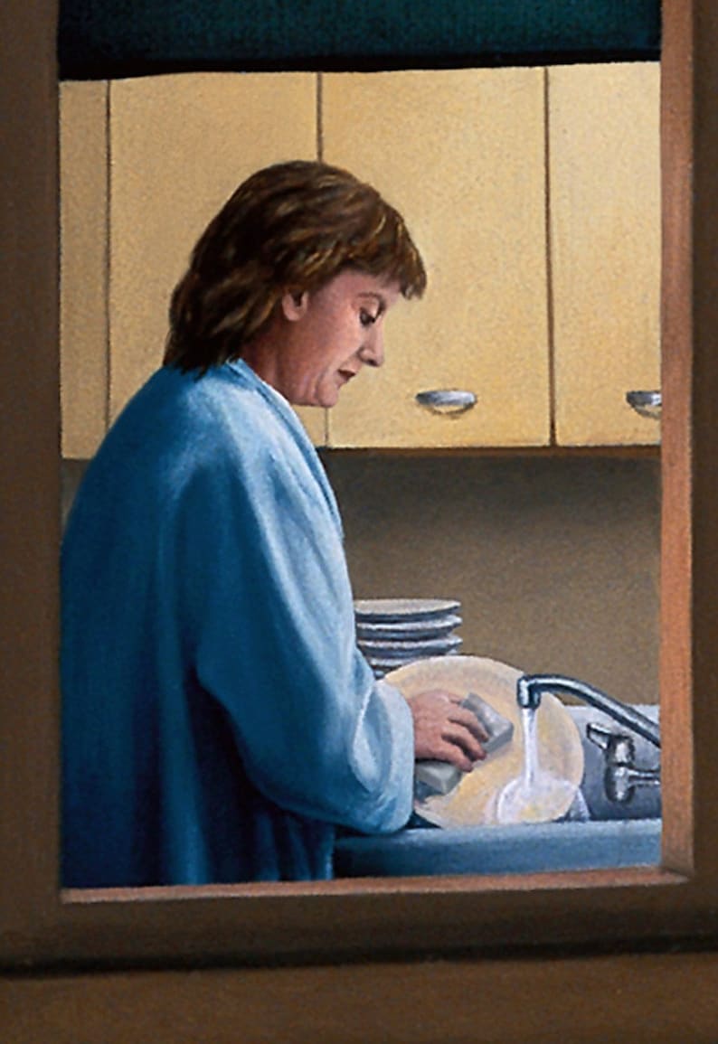 May include: A woman in a blue robe washes dishes in a kitchen sink. She is using a sponge to wash a plate. There are other plates stacked on the counter behind her.