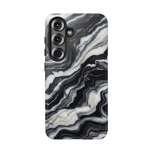 May include: A smartphone case with a black and white marble design. The case has a glossy finish and features a camera module with three lenses. The marble pattern has flowing lines of black and white, creating a natural, elegant look.