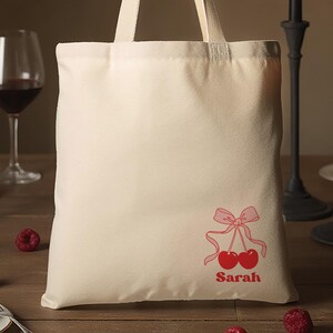 Custom Bachelorette Tote Bag – Cherry Coquette Bow with Personalized Name and Hand-Drawn Illustration