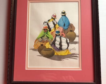 May include: Framed watercolor painting depicting a group of people in colorful clothing and hats, gathered near several brown pots. The artwork is set against a pink mat and framed in a dark brown wooden frame. The painting has a folk art style.