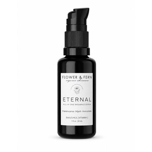May include: A black glass bottle with a black pump dispenser containing Eternal All-In-One Radiance Serum by Flower & Fern. The white label features a floral icon, the text Bakuchiol, Vitamin C, Frankincense, Myrrh, Immortele, and 1 fl oz 30 mL.
