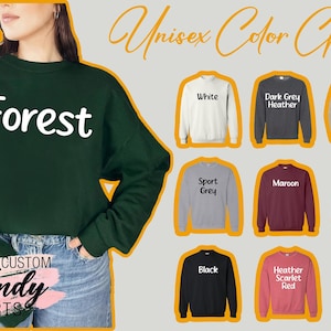 May include: A dark green sweatshirt with the word "Forest" in white lettering. The image also displays a color chart of sweatshirts in various colors, including white, gray, maroon, and red. The text "Unisex Color Chart" is at the top.