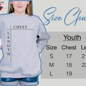 May include: A light gray youth sweatshirt with a size chart. The chart shows chest measurements of 17, 18, and 19 inches, and lengths of 21 1/4, 22 1/2, and 24 inches for sizes S, M, and L, respectively. The brand name "Trendy Shirts" is in the upper left corner.
