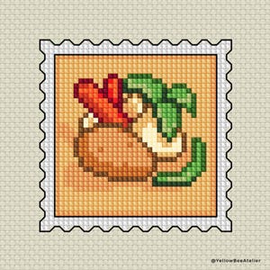 May include: A cross-stitch design of a stamp featuring a brown bowl with red and green vegetables. The stamp has a white border with a black, scalloped edge. The background is a light beige fabric.