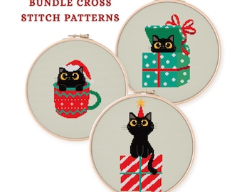 May include: Three cross-stitch patterns in wooden hoops. Each features a black cat with yellow eyes. One cat is in a mug, another in a gift box, and the third on a gift box with a star on its head. The text "BUNDLE CROSS STITCH PATTERNS" is at the top.