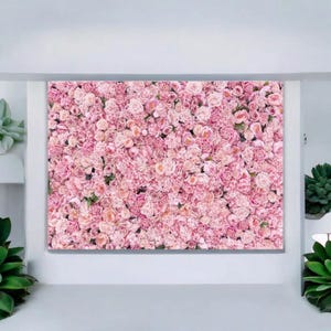 May include: A rectangular canvas print featuring a dense arrangement of pink roses. The roses vary in shades of pink, creating a textured and visually appealing floral display. The print is set against a white background.