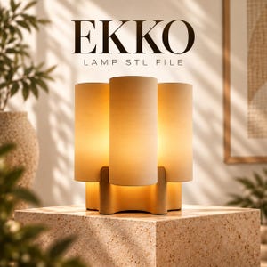 May include: A table lamp featuring three vertical cylindrical shades in a matte beige finish, arranged around a central base. The text EKKO LAMP STL FILE is displayed above the lamp. The lamp emits a warm, soft glow from within the cylinders.