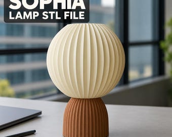 May include: A table lamp with a spherical, cream-colored, vertically ribbed shade and a smaller, brown, vertically ribbed base. The text 'SOPHIA LAMP STL FILE' is displayed in a black box in the upper left corner of the image.