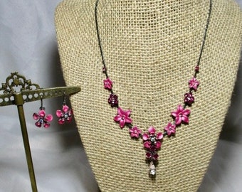 A 1998 Set of Pearlized. Pink and Magenta Jeweled Like Flowers Necklace with Matching Earrings
