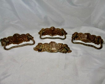 A Set of Four Antique Victorian Late 1800's Molded Embossed Metal Drawer pUlls.