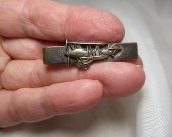 A 1950's Biplane Tie Clip Tie Clasp In Silver and Gold Tones.