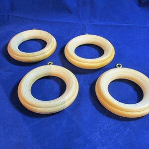 A Set of Four Large Wooden Natural Looking Cafe Curtain Rings/Needlework Frames.