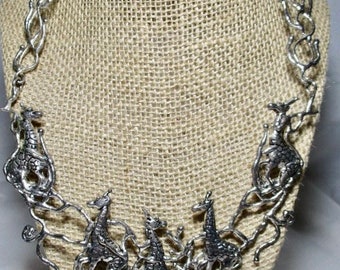 A 1990's Hand Casted Art Show GIRAFFES Choker Necklace in a Silver Tone.