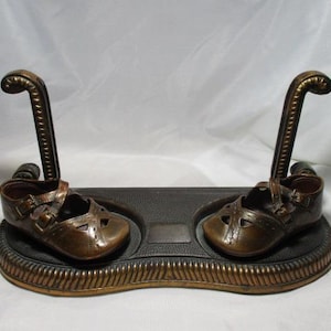 A 1955 Pair of Little Girls Bronze Shoes on w/Copper Base and Stand for Picture Frame.Super-sized