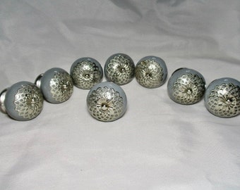 A Set of Eight Dark Gray with Silver Tone Filagree Overlays on the Front Ceramic Knobs/Drawer Pulls.