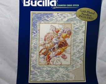 A 1999 BUCILLA Counted Cross Stitch TRANQUILITY Beach Shell Themed Kit.