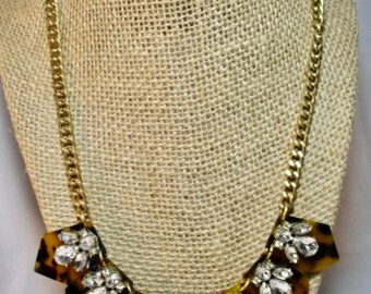 A Vintage J.CREW Tortoiseshell Like with Rhinestone Accents on a Gold Tone Chain Necklace.