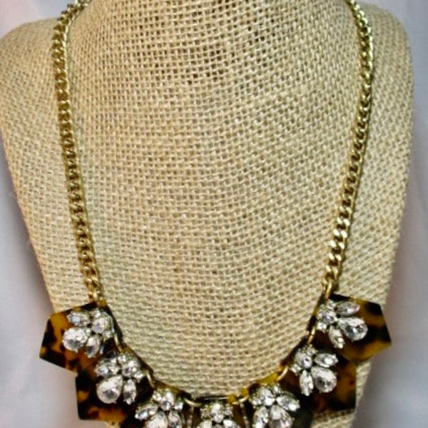 A Vintage J.CREW Tortoiseshell Like with Rhinestone Accents on a Gold Tone Chain Necklace.