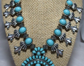 A Vintage Spring Street Brand SQUASH BLOSSOM NECKLACE in a Silver Tone.