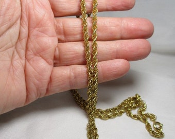 A Vintage, 30 Inch Slender Golden Tone Twisted Rope Chain.
