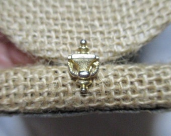 A Vintage Golden Tone Miniature Door Knocker pin/Tie Tack.