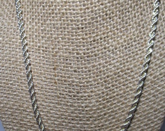 A Vintage, Twenty Inch Silver Tone Slender Rope Chain Necklace.