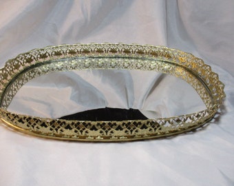 A 1960's Golden Ormolu Like Oval Mirrored Makeup Tray Vanity Tray.