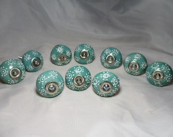A Set of Ten, Ceramic Turquoise in Color with Raised White Glazed Designs Drawer/Cabinet Knobs.