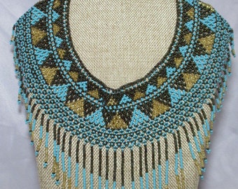 A 1980's Native American Pattern Seed Bead Bib Styled Choker Necklace in Turquoise, Gold & Brown Beads.