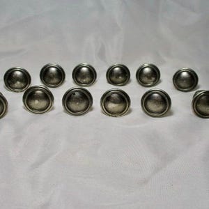 A set of Twelve Previously Used Nice Antiqued Pewter Heavy Knobs For Drawers and Cabinets.