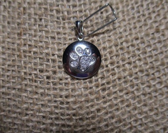 1998 A 925 Sterling Silver Charm/Pendant with Paw Print Accents with White Sapphires .