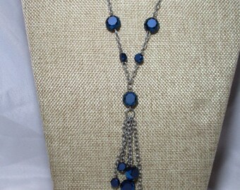 A 1998 Midnight Blue Sparkling and Shimmering Crystal Bead dangle Necklace on a Silver Tone Chain.