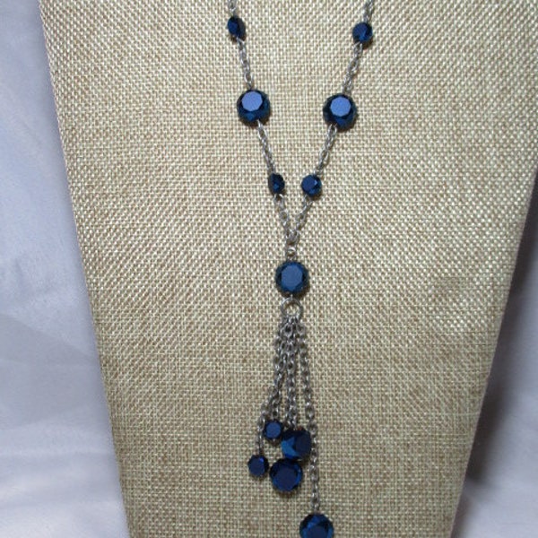 A 1998 Midnight Blue Sparkling and Shimmering Crystal Bead dangle Necklace on a Silver Tone Chain.