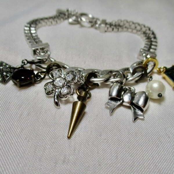 A Vintage, JUICY COUTURE Silver Tone Box Chain Charm Bracelet with Seven ,Dangly Charms.