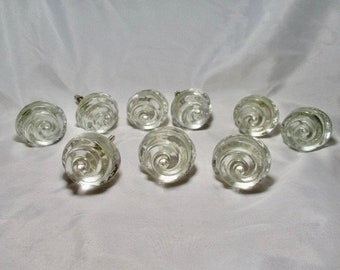 A Set of Nine Clear Swirled Glass Molded Drawer Pulls Knobs with Hardware.