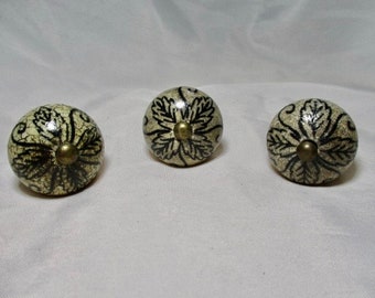 Three Ceramic Light Tan/Brown Knobs w/Crackle Finish and Black Painted Leaf Designs.