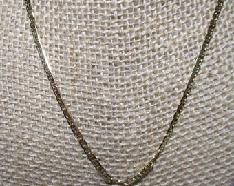 A Vintage, Flat Mariner-Linked Gold Tone Chain in a 20" Length.