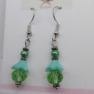 Handmade: dangle earrings with green Swarovski elements, fire Polished Glass, and sterling ear wires. A Great Gift for her. Made in the USA.