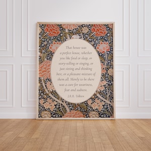 May include: A rectangular wall art print featuring a central oval containing the J.R.R. Tolkien quote: That house was a perfect house, whether you like food or sleep, or story-telling or singing, or just sitting and thinking best. The background is a dark floral pattern with orange and cream flowers and green leaves.