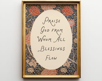 May include: Framed art print with the words "Praise God From Whom All Blessings Flow" in elegant script. The artwork is set against a cream-colored oval, surrounded by a floral pattern in red, orange, and blue, within a gold frame.