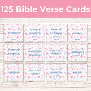 May include: 125 Bible Verse Cards with floral designs in pink and blue. Each card features a Bible verse in black text. The cards are arranged on a light wood-grain surface.